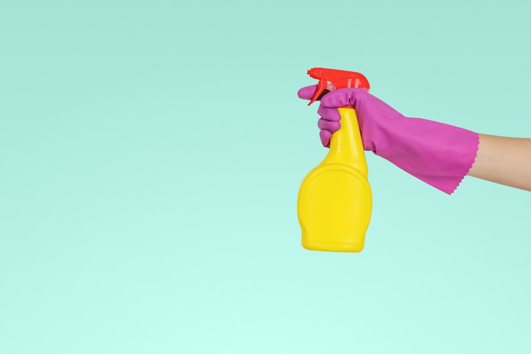 heros-img person-holding-yellow-plastic-spray-bottle-zmnefoi3k